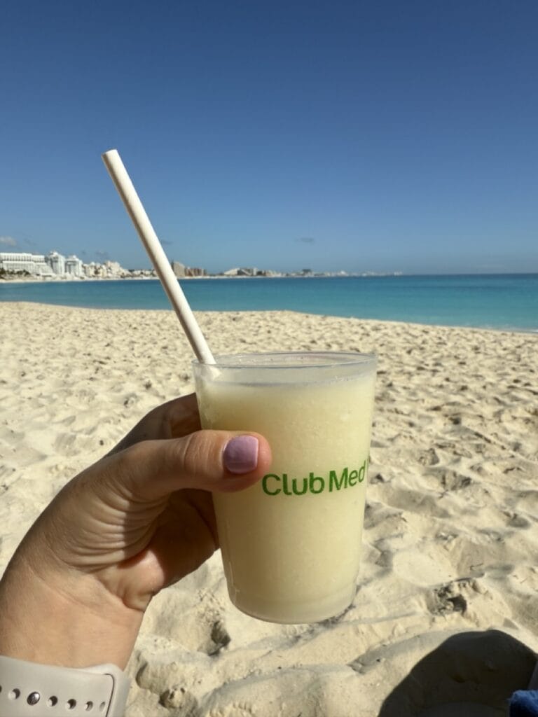 Main beach with a pina colada at Club Med Cancun